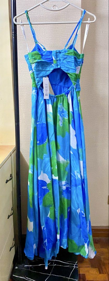 Ever New Blue Ruched Maxi Dress (Category: Dresses) located in Quezon City. Submitted by babyblue2022 (Listing ID 1447287906, Image 2). Description: - Beautiful blue and green floral maxi dress from Forever New. - Features a flattering ruched bodice and adjustable straps. - With side zipper closure - Elegant cut-out detail at the back. - Perfect for special events and garden parties - Brand new, never been worn with original tags still attached. 