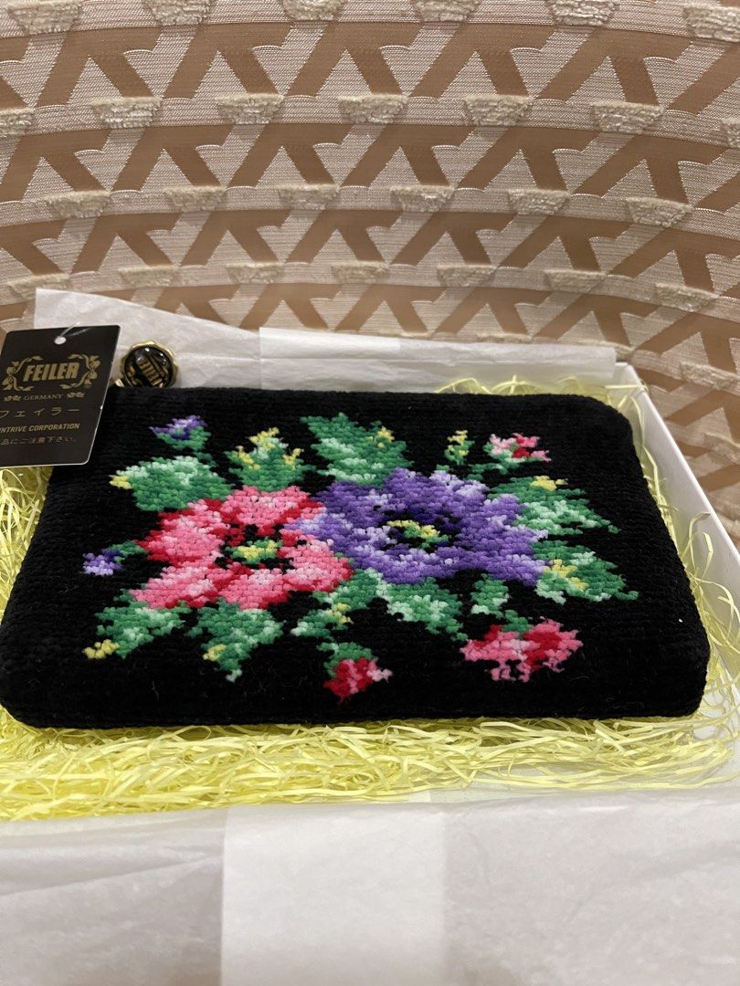 Feiler Germany Black Floral Embroidered Pouch (Category: Purses & Pouches) located in Davao. Submitted by giftopia (Listing ID 1447192989, Image 2). Description: Cute Feiler pouch with floral embroidery. Black with pink, purple, green flowers. Zipper closure. Comes with tags & box. Perfect for small essentials..