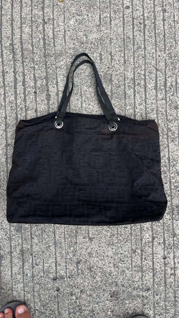 Fendi Zucca Pattern Tote Bag (Category: Luxury Bags & Wallets) located in Polomolok. Submitted by warmfire.3185dd (Listing ID 1447290490, Image 2). Description: - Authentic black Fendi tote bag - Features the classic Zucca pattern - Spacious interior for all your essentials - Comfortable dual shoulder straps - Secure zipper closure with Fendi branded pull - Includes authenticity tag - Ideal for everyday use.