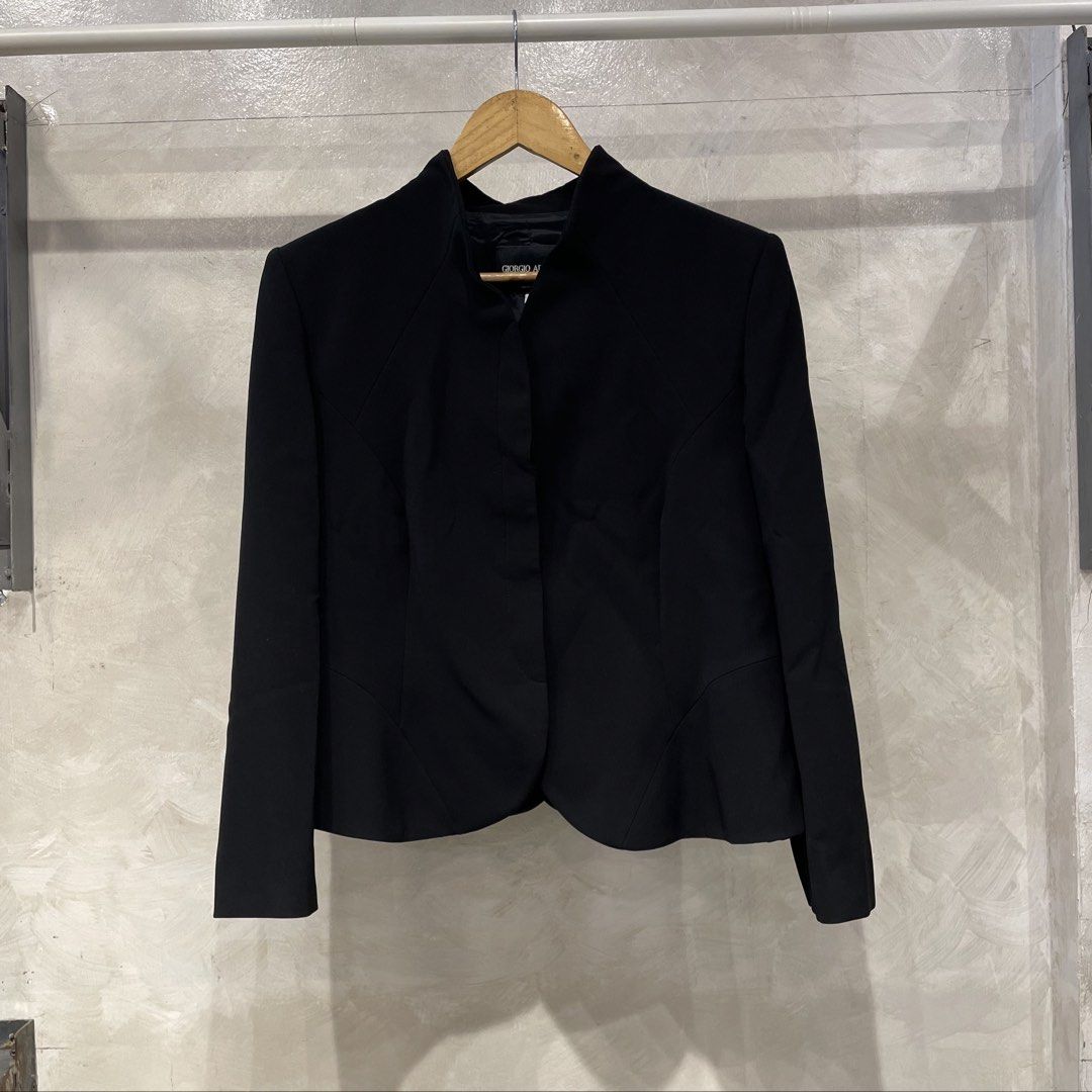 Giorgio Armani Mandarin Style Blazer (Category: Coats, Jackets and Outerwear) located in Manila. Submitted by walter_wt (Listing ID 1447214386, Image 1). Description: Giorgio Armani Mandarin Style Blazer Tagged size- 48 Dimension- Length- 24 Width-20 Sleeve length- 22 No issue. This black Giorgio Armani jacket features a sophisticated, minimalist silhouette characterized by its structured shoulders, high stand collar, and a concealed front closur