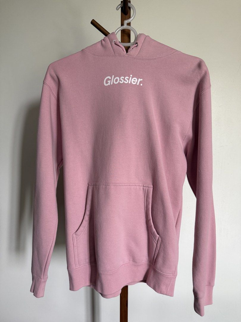 Glossier Pink Hoodie Size Small (Category: Coats, Jackets and Outerwear) located in Marikina City. Submitted by samndbx (Listing ID 1447122161, Image 2). Description: - Pink Glossier hoodie - Size: Small (W: 52cm L: 68cm) - Glossier logo on the front - Smiley face with wave emoji graphic on the back - Kangaroo pocket - Drawstring hood - Retails for ₱4,500.