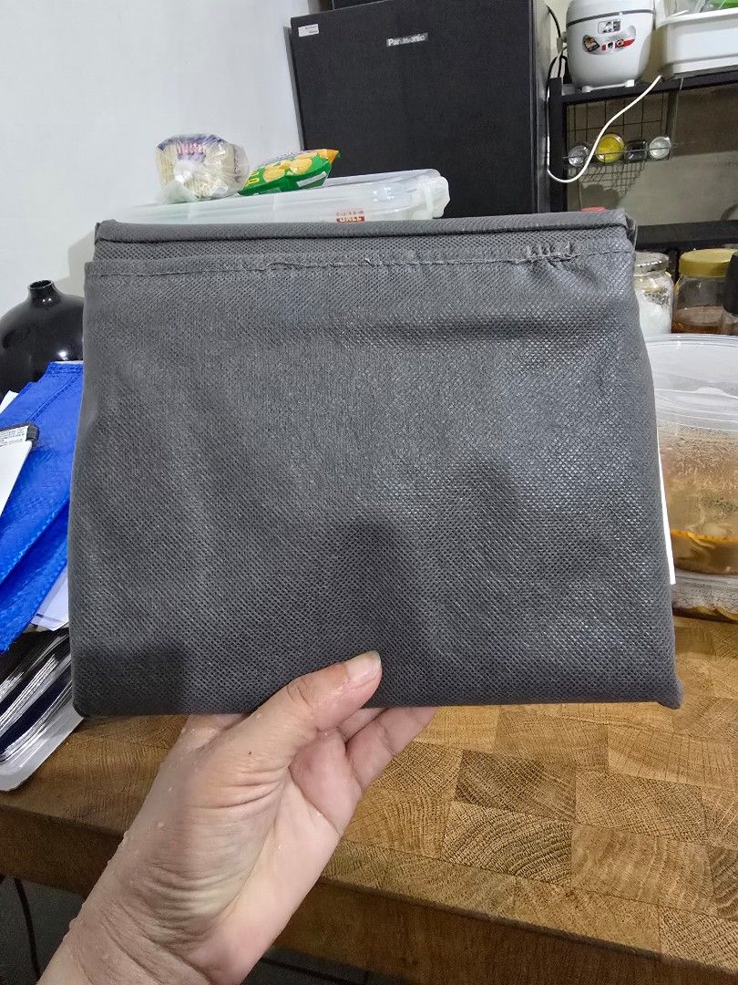 Grey Drawstring Storage Bag (Category: Storage Boxes & Baskets) located in Makati City. Submitted by shopaholicsgallery (Listing ID 1447212554, Image 2). Description: - IKEA grey drawstring storage bag - Ideal for organizing clothes, toys, and household items - Made of durable fabric - Folds flat for convenient storage - Keeps closets and shelves tidy - Easy drawstring closure - Brand: IKEA.