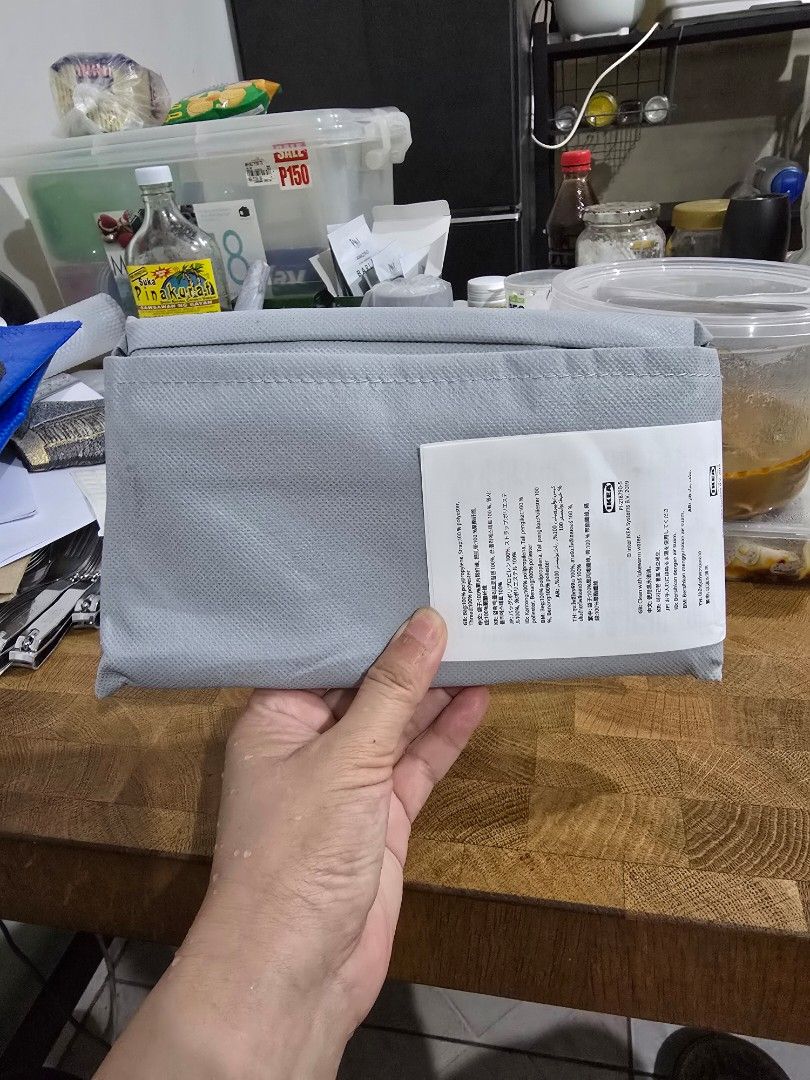 Grey Drawstring Storage Bag (S) (Category: Storage Boxes & Baskets) located in Makati City. Submitted by shopaholicsgallery (Listing ID 1447213535, Image 2). Description: - Grey IKEA storage bag - Features recycle symbol print - Secure drawstring closure - Ideal for storing items or laundry - Approximate dimensions: [insert dimensions if known].