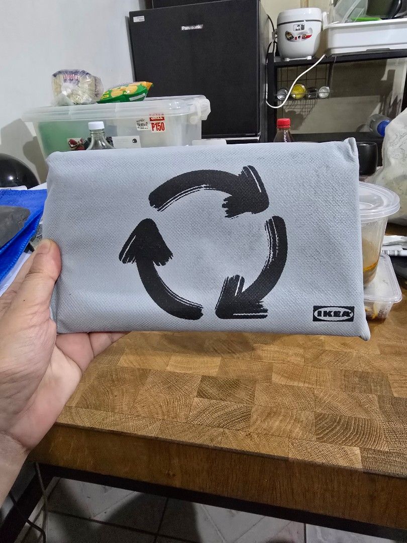 Grey Drawstring Storage Bag (S) (Category: Storage Boxes & Baskets) located in Makati City. Submitted by shopaholicsgallery (Listing ID 1447213535, Image 1). Description: - Grey IKEA storage bag - Features recycle symbol print - Secure drawstring closure - Ideal for storing items or laundry - Approximate dimensions: [insert dimensions if known].