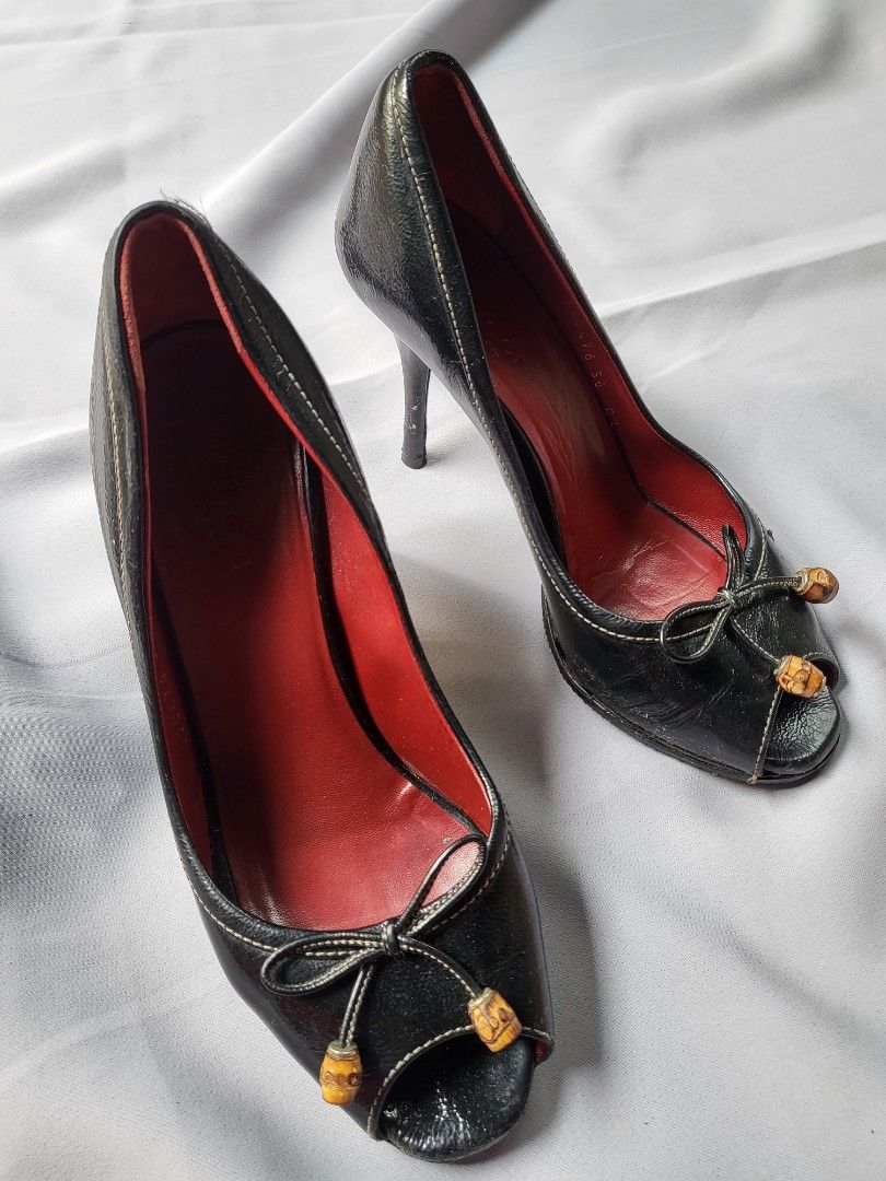 Gucci black leather peep-toe heels (Category: Heels) located in Makati City. Submitted by nvdluxurygoods (Listing ID 1447185559, Image 1). Description: Ready to ship Gucci black leather peep-toe heels feature distinct bamboo detailing on the bow. size 6 on tag, but size 7 exact. depends on your feet (let me know willing to assist you properly).