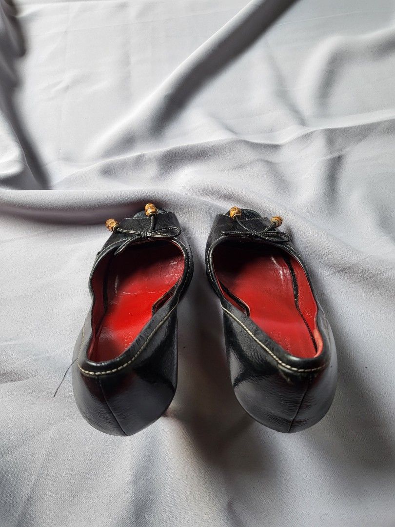 Gucci black leather peep-toe heels (Category: Heels) located in Makati City. Submitted by nvdluxurygoods (Listing ID 1447185559, Image 2). Description: Ready to ship Gucci black leather peep-toe heels feature distinct bamboo detailing on the bow. size 6 on tag, but size 7 exact. depends on your feet (let me know willing to assist you properly).