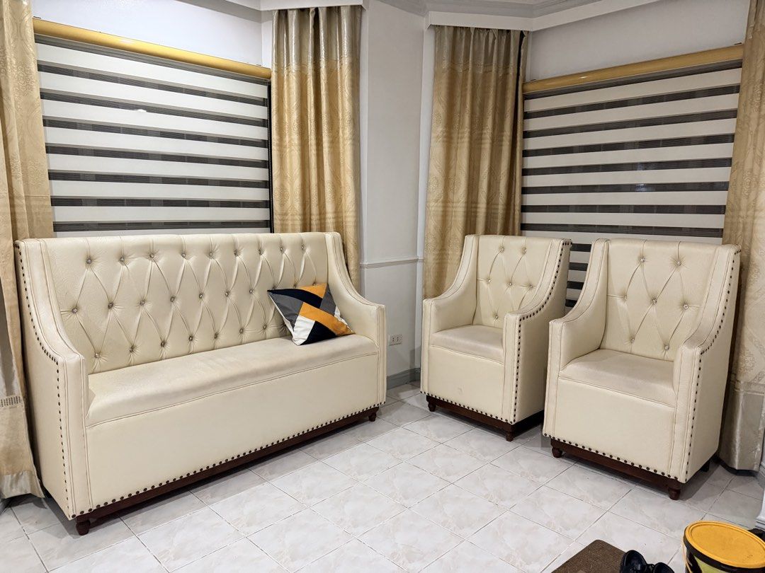 Heavy wooden Sala set (Category: Sofas) located in Manila. Submitted by shizg (Listing ID 1447110568, Image 1). Description: Upholstered wooden sala set. 1pc-3seater & 2pcs-1seater. Minimal signs of wear & tear especially on its gold rivets but can be used as is with minimal cleaning. It is covered with leather so it is easy to clean. For pick up only! 📌pls note that this sala set is heavy, Need may kasama magbuhat. .