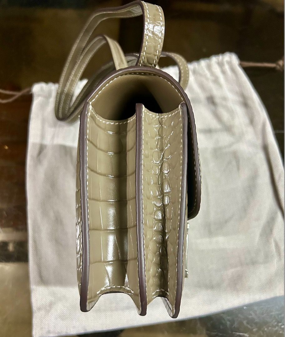 Hermes Constance Bag (Category: Luxury Bags & Wallets) located in Caloocan City. Submitted by hermes_evangelista (Listing ID 1447222694, Image 3). Description: A classic Hermes bag that can be as hard to find as the Birkin or Kelly bag. This pre-loved Hermes Constance in Gris Tourterelle, made of Crocodile Niloticus leather (with the symbol used is a double dot (··) next to the Hermès logo) exudes luxury. This chameleon-like color transforms from
