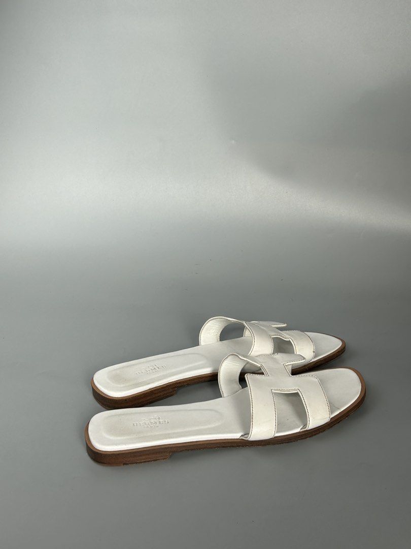Hermes Oran Sandals White Leather Size 38 (Category: Sneakers & Footwear) located in Tacloban City. Submitted by houseofluxury.co (Listing ID 1447161484, Image 3). Description: - Authentic Hermes Oran Sandals - Color: White Leather - Size: 38 - Made in Italy - Classic 'H' Design - Provided dustbag inclusion - Ideal for everyday wear.