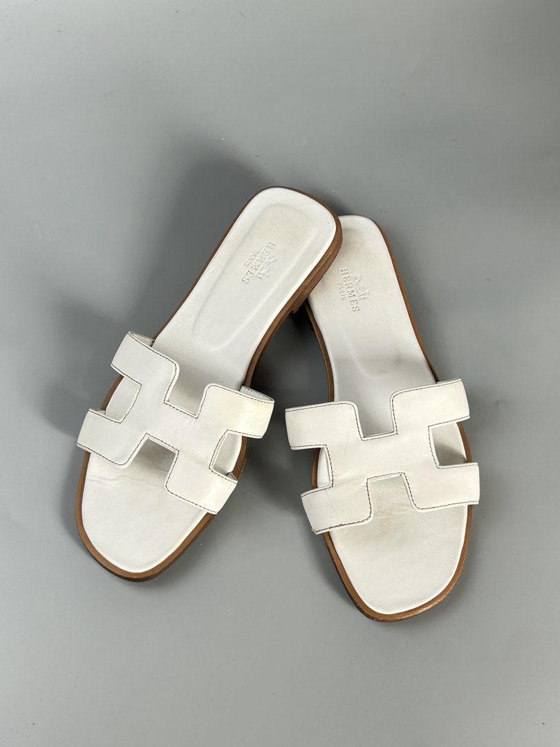 Hermes Oran Sandals White Leather Size 38 (Category: Sneakers & Footwear) located in Tacloban City. Submitted by houseofluxury.co (Listing ID 1447161484, Image 1). Description: - Authentic Hermes Oran Sandals - Color: White Leather - Size: 38 - Made in Italy - Classic 'H' Design - Provided dustbag inclusion - Ideal for everyday wear.