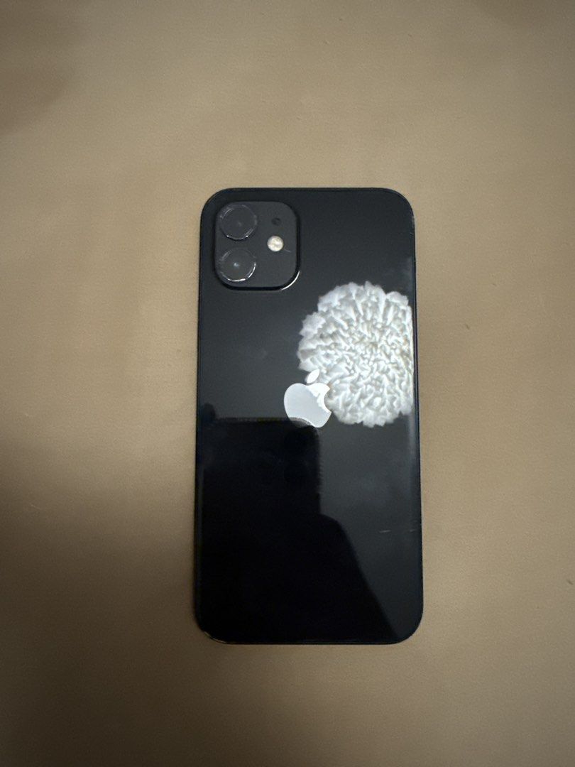 iPhone 12 (128gb) (Category: iPhone 12 Series) located in Paranaque City. Submitted by tojo0 (Listing ID 1447248937, Image 2). Description: For sale: iPhone 12 128gb No Sim Restrictions Well Used (with signs of some minor scratches) Issues: Battery Health is maximum at 72% otherwise working well. RFS: Extra Phone need to dispose Comes with lightning cable only .