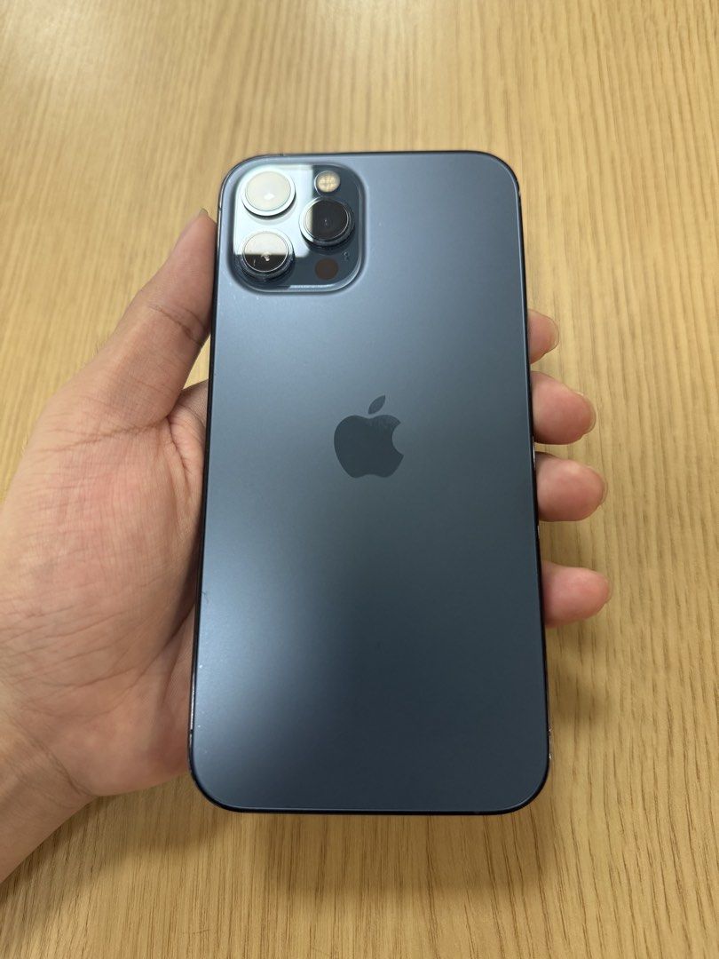 IPHONE 12 Pro Max 128GB PACIFIC BLUE LIKE NEW (Category: iPhone 12 Series) located in Quezon City. Submitted by marcothegreat1992 (Listing ID 1447116462, Image 1). Description: For Sale: Iphone 12 Pro Max 128GB Pacific Blue Like new condition! Factory Unlocked Local Variant LL/A Model No Sim Restrictions IOS 26.5 (Latest Update) 78% Battery Health Original (Sobrang kunat, 2 days pa ako bago mag charge ulit) True Tone and Face ID Working Bought Fr