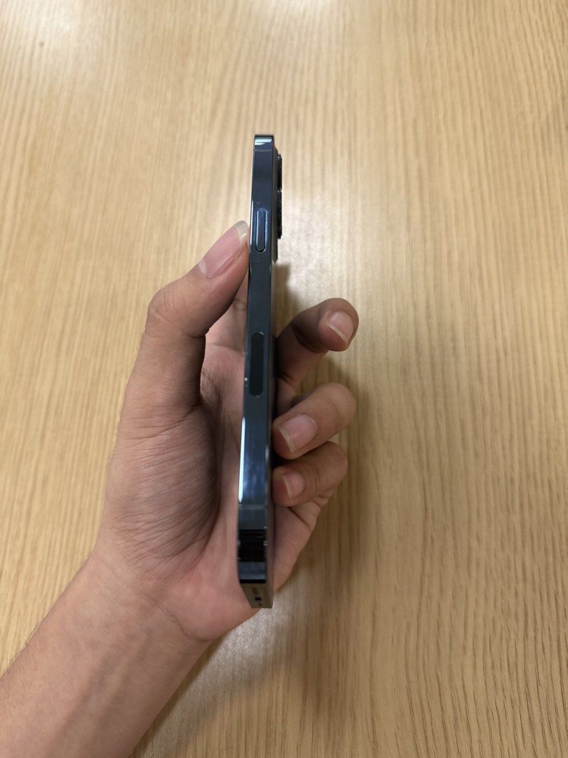 IPHONE 12 Pro Max 128GB PACIFIC BLUE LIKE NEW (Category: iPhone 12 Series) located in Quezon City. Submitted by marcothegreat1992 (Listing ID 1447116462, Image 3). Description: For Sale: Iphone 12 Pro Max 128GB Pacific Blue Like new condition! Factory Unlocked Local Variant LL/A Model No Sim Restrictions IOS 26.5 (Latest Update) 78% Battery Health Original (Sobrang kunat, 2 days pa ako bago mag charge ulit) True Tone and Face ID Working Bought Fr