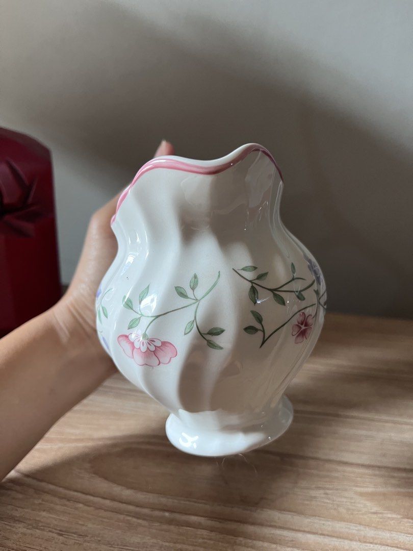 Johnson Brothers Summer Chintz milk jug (Category: Coffee & Tea Tableware) located in Quezon City. Submitted by metamerchant (Listing ID 1447293405, Image 3). Description: - White ceramic creamer jug - Features a lovely floral pattern with pink, purple, and yellow flowers - Delicate pink trim on the rim - Unique twisted design all around - Made in England - Ideal for serving milk or cream.