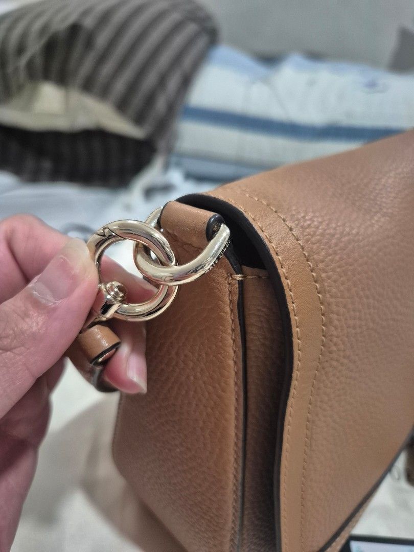 Kate Spade Hudson Convertible Shoulder (Category: Cross-body Bags) located in Manila. Submitted by kimfl (Listing ID 1447249139, Image 2). Description: - Brand: Kate Spade New York - Material: Brown pebble leather - Style: Crossbody bag - Features: Adjustable strap, original tag attached - Includes: Dust bag - RFS: Decluttering .