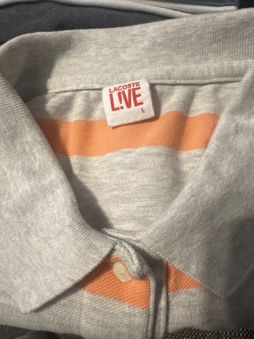 Lacoste Live Striped Polo Shirt (Category: Shirts) located in Quezon City. Submitted by mystash2.o (Listing ID 1447201667, Image 2). Description: - Lacoste Live grey and coral striped polo shirt - Classic crocodile logo on chest - Button-up neckline - Perfect for casual outfits.