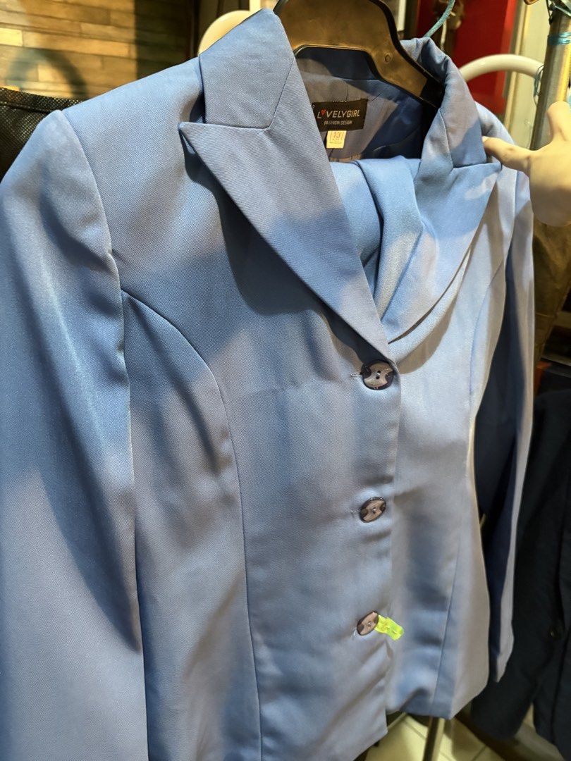 Light Blue Blazer and Skirt Suit Set (Category: Sets or Coordinates) located in Manila. Submitted by hii678 (Listing ID 1447121309, Image 3). Description: - Professional light blue suit set - Includes tailored blazer and knee-length skirt - Blazer features 3 buttons and classic lapel - Skirt has a slit for ease of movement - Ideal for work or formal occasions - Label reads 'Lovely Girl'.