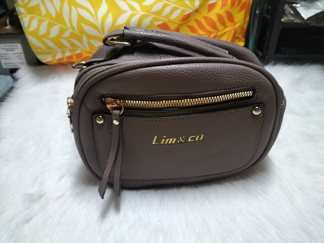 Lim & Co. Brown Crossbody Bag (Category: Luxury Bags & Wallets) located in Taytay. Submitted by tina.bel.s (Listing ID 1447225257, Image 2). Description: - Brown crossbody bag by Lim & Co. - Zippered main compartment for secure storage - Front zippered pocket for quick access - Elegant gold hardware details - Detachable strap for versatile wear - Ideal size for carrying your essentials MOP:Gcash, Maya or Gotyme MOD: j&t, Lalamove, LBC COP message