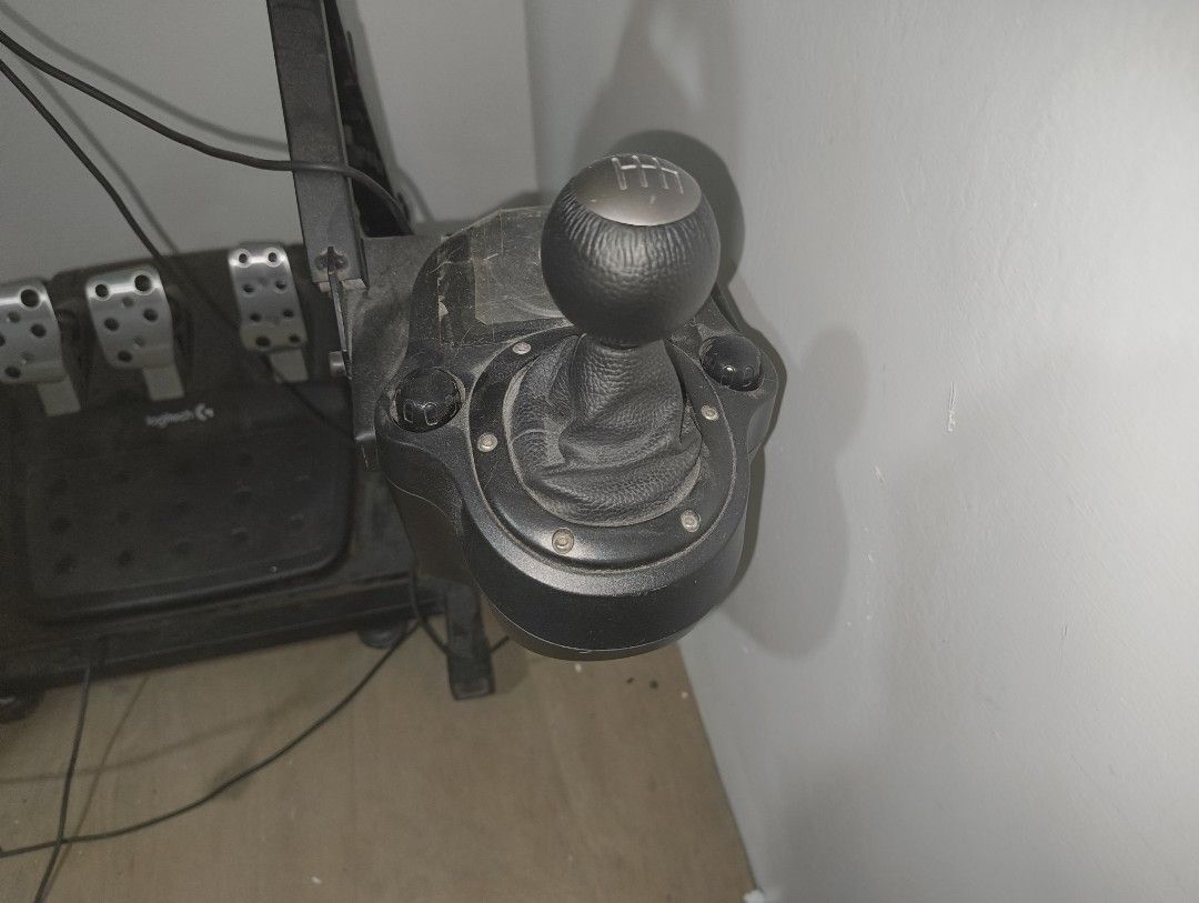 Logitech G29 Driving Force Racing Wheel Pedals Shifter (Category: Controllers) located in Taguig. Submitted by dardex.dardex (Listing ID 1447116661, Image 3). Description: - Logitech G29 wheel, pedals, and shifter with Stand - Wheel, pedals, and shifter are in good condition - Issues with stand as seen in the picture, the screwable footing plastic is broken - Reason for selling: No time to use it anymore .