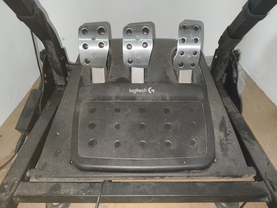 Logitech G29 Driving Force Racing Wheel Pedals Shifter (Category: Controllers) located in Taguig. Submitted by dardex.dardex (Listing ID 1447116661, Image 2). Description: - Logitech G29 wheel, pedals, and shifter with Stand - Wheel, pedals, and shifter are in good condition - Issues with stand as seen in the picture, the screwable footing plastic is broken - Reason for selling: No time to use it anymore .