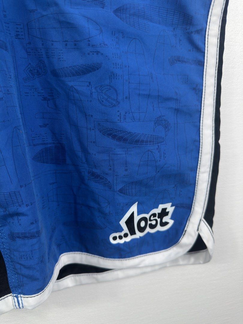 Lost Surf Board Shorts Size 32 Black Blue (Category: Swim Trunks & Board Shorts) located in Manila. Submitted by collect__ph (Listing ID 1447132505, Image 2). Description: - Brand: Lost - Type: Board Shorts - Color: Black and Blue Color Block - Design: All-over print on blue panels - Size: 32 - Material: 100% Polyester - Ideal for: Beach or Pool.