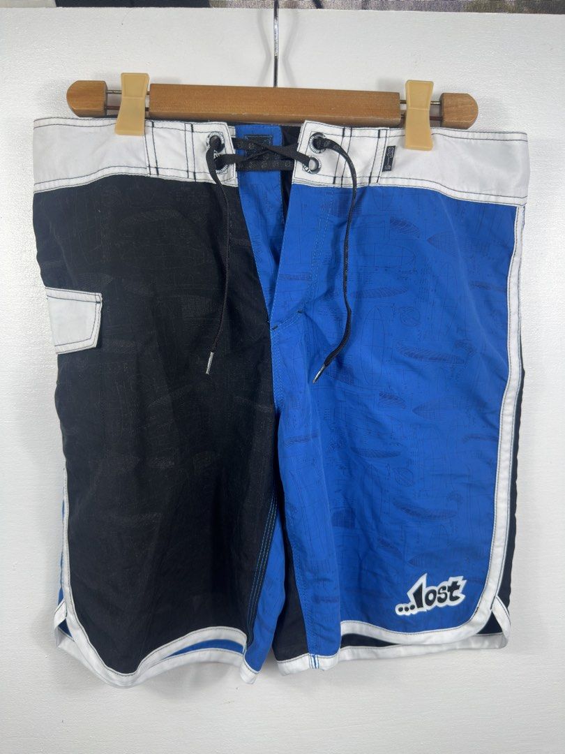 Lost Surf Board Shorts Size 32 Black Blue (Category: Swim Trunks & Board Shorts) located in Manila. Submitted by collect__ph (Listing ID 1447132505, Image 1). Description: - Brand: Lost - Type: Board Shorts - Color: Black and Blue Color Block - Design: All-over print on blue panels - Size: 32 - Material: 100% Polyester - Ideal for: Beach or Pool.