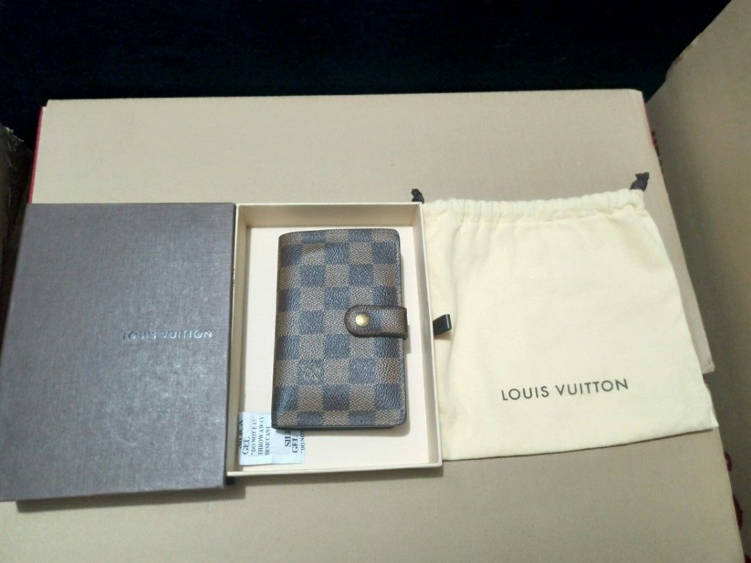 Louis Vuitton Damier Ebene Small Wallet (Category: Luxury Bags & Wallets) located in Manila. Submitted by tindahan.ni.nanay (Listing ID 1447170463, Image 1). Description: Louis Vuitton Damier Ebene French Kiss Lock Wallet It features the iconic brown checkerboard coated canvas, gold-tone hardware, a secure kiss-lock coin pocket, and a snap button opening that reveals cross-grain leather, card slots, and bill compartments With dust bag and box .