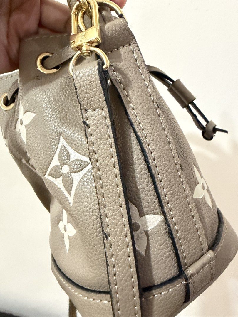Louis Vuitton Monogram Bucket Bag (Category: Luxury Bags & Wallets) located in Manila. Submitted by neri_declutters (Listing ID 1447115243, Image 2). Description: - Stylish taupe bucket bag with iconic Louis Vuitton monogram print. - Elegant gold hardware accents. - Secure drawstring closure. - Versatile carrying options: top handle or detachable shoulder strap. - Compact size, ideal for everyday use and carrying your essentials..