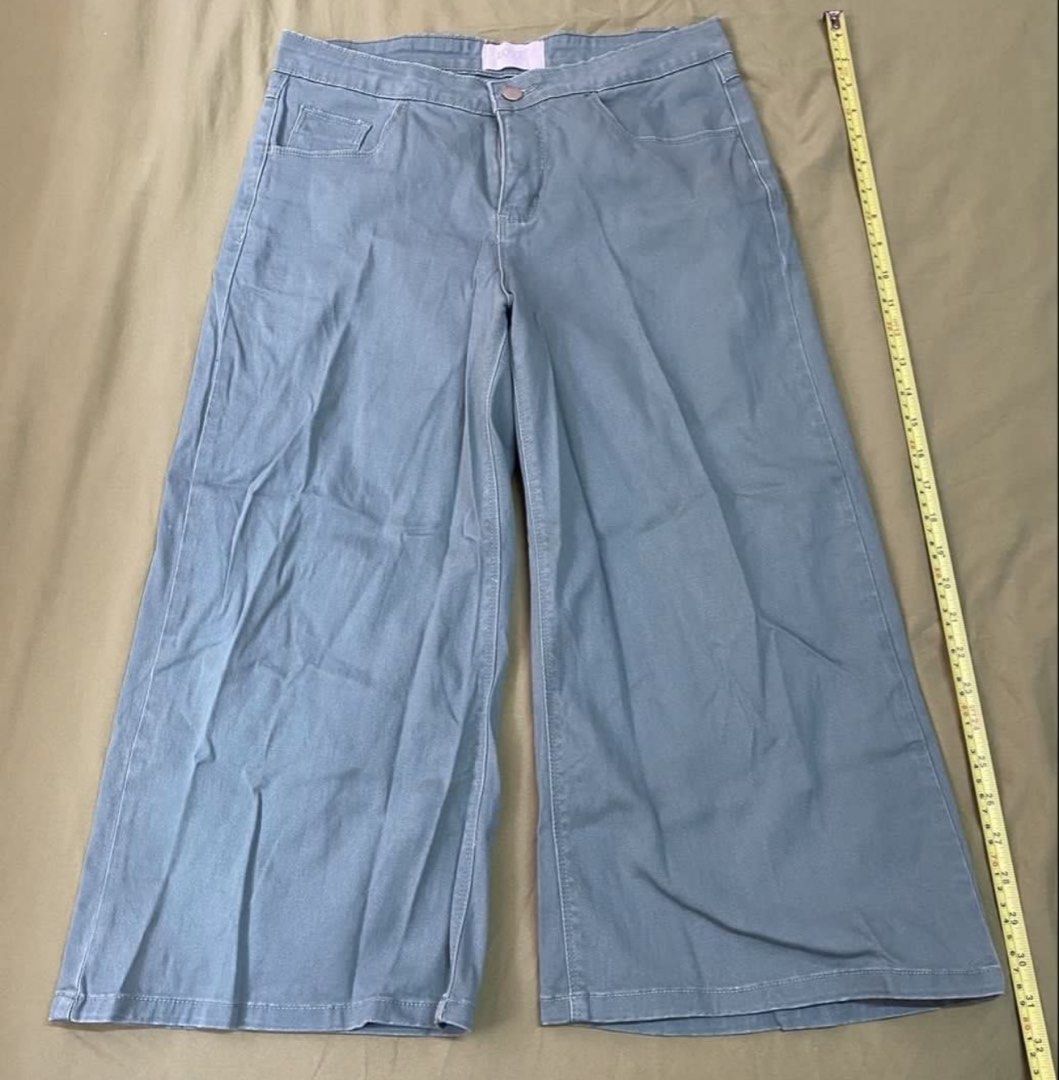 LOVE BAYO Wide Leg Pants (Category: Other Bottoms) located in Cebu City. Submitted by lucypim (Listing ID 1447129865, Image 2). Description: - LOVE BAYO green wide-leg pants - High-waisted design - Button and zip closure - Two front pockets - Two back pockets - Comfortable fabric - Ideal for casual wear.