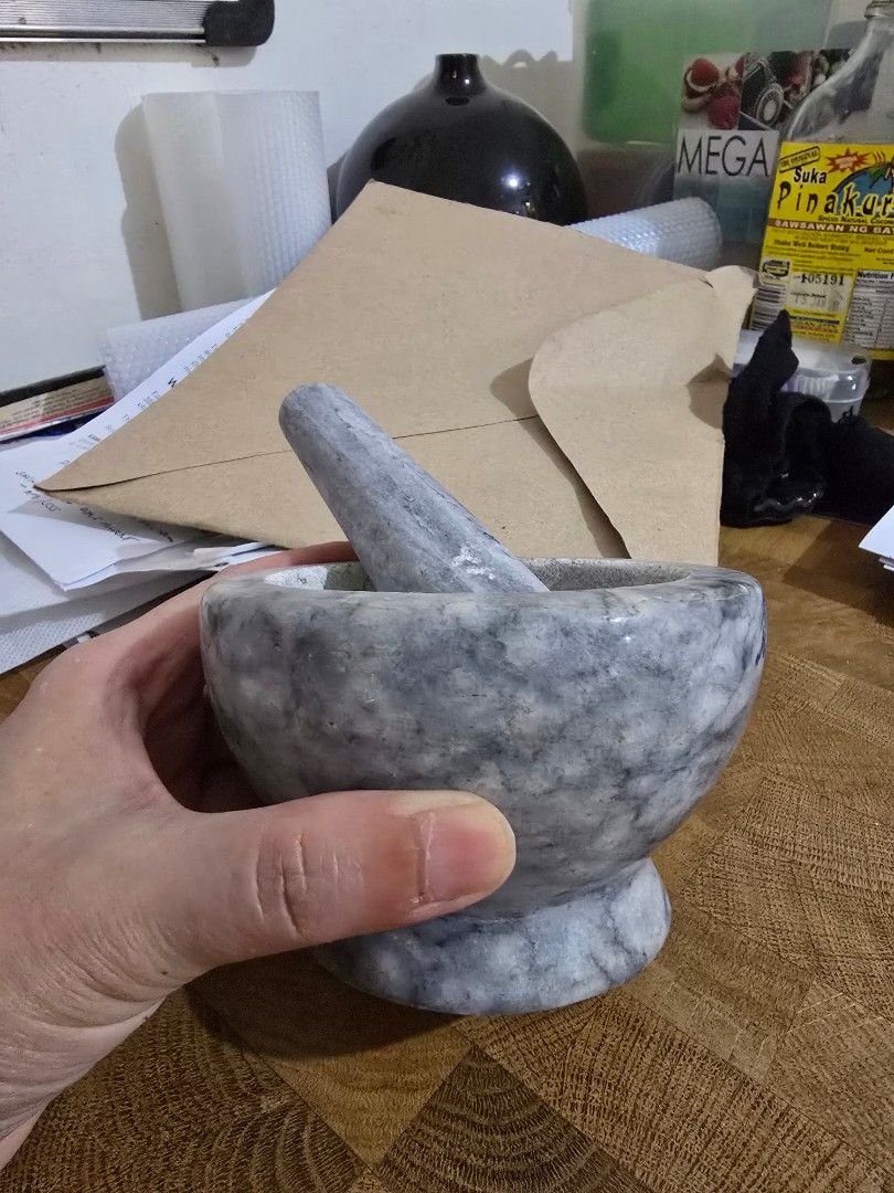 Marble Mortar and Pestle Set (Category: Other Kitchenware & Tableware) located in Makati City. Submitted by shopaholicsgallery (Listing ID 1447140617, Image 1). Description: - Heavy duty marble mortar and pestle - Ideal for grinding spices and herbs - Features beautiful grey veining - Pestle designed for a comfortable grip - Essential kitchen tool - RFS: decluttering.