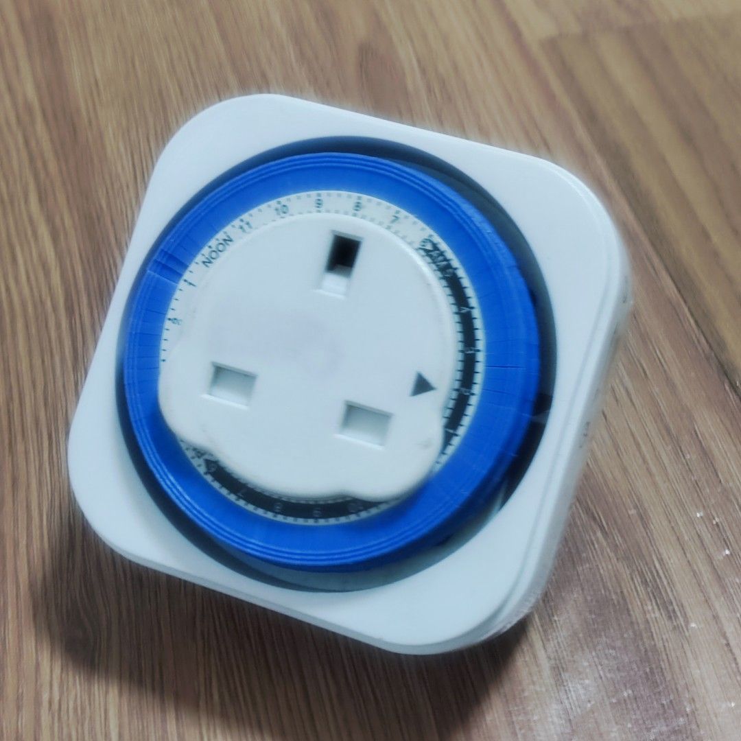 Mechanical Timer Plug Socket (Category: Electrical, Adaptors & Sockets) located in Singapore. Submitted by veggiee (Listing ID 1447273157, Image 1). Description: Mechanical timer plug for controlling appliances. Set your desired on/off times easily with the rotating dial. Just plug it in and set the pins to your schedule. Great for lamps, fans, or other household electronics. Simple to use and very practical..