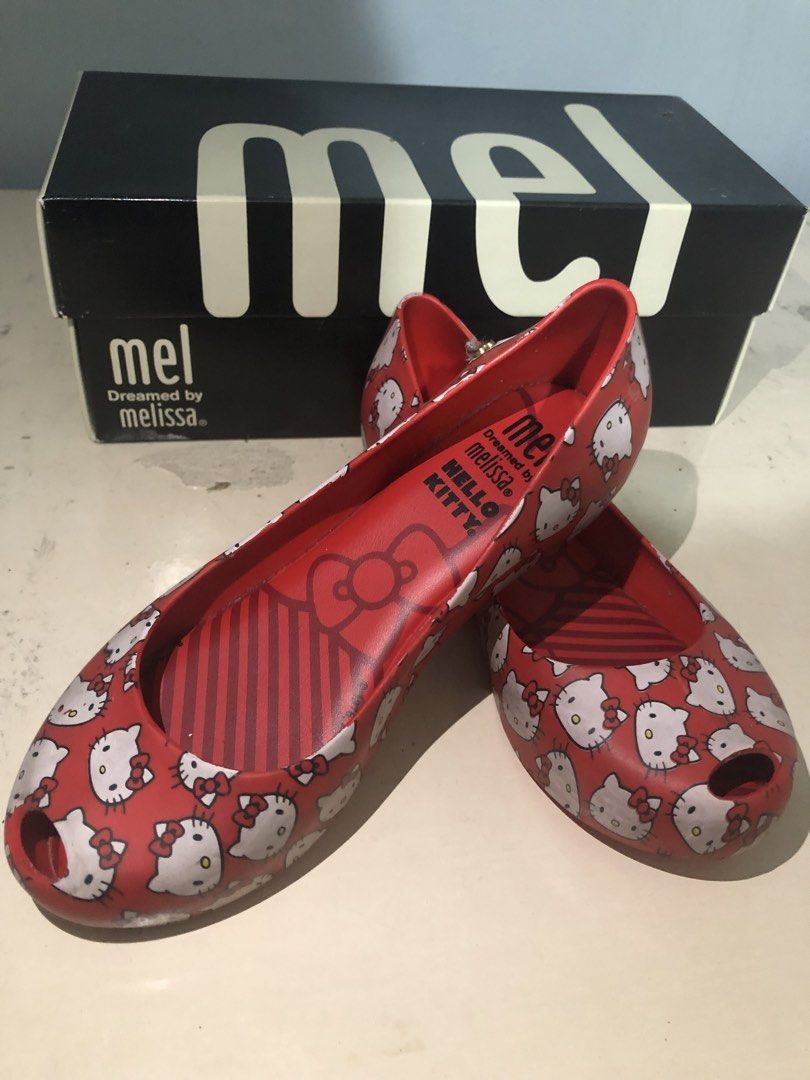 Melissa x Hello Kitty Red Jelly Flats (Category: Flats & Sandals) located in Pasig City. Submitted by declutterwithjellie (Listing ID 1447187275, Image 1). Description: - Adorable red Melissa jelly flats - Features a charming all-over Kitty print - Special collaboration with Kitty - Sole sizes indicated: 12, 28, 30, 18.5 - Authentically made in Brazil - Comes with the original box.