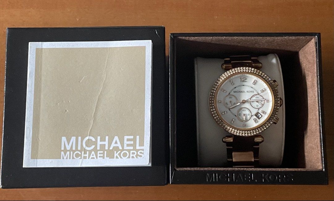 Michael Kors Rose Gold Chronograph Watch (Category: Luxury Watches) located in Manila. Submitted by somethingnewandloved (Listing ID 1447145595, Image 2). Description: - Rose gold Michael Kors watch - White dial with crystal markers - Date window feature - Chronograph function included - Comes with original box - Versatile for dressing up or everyday wear - Selling because it's not worn often.