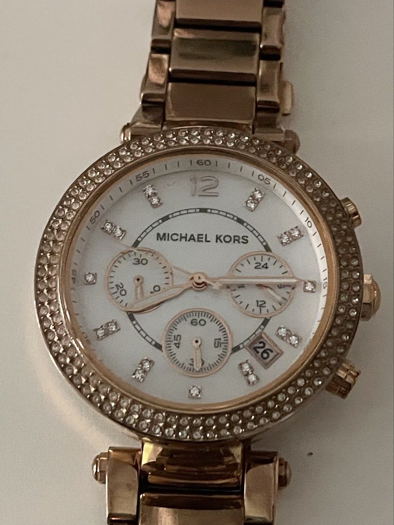 Michael Kors Rose Gold Chronograph Watch (Category: Luxury Watches) located in Manila. Submitted by somethingnewandloved (Listing ID 1447145595, Image 3). Description: - Rose gold Michael Kors watch - White dial with crystal markers - Date window feature - Chronograph function included - Comes with original box - Versatile for dressing up or everyday wear - Selling because it's not worn often.