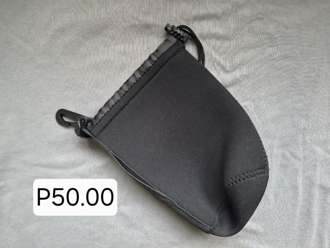 Neoprene Pouch with Carabiner and Drawstring (Category: Camera Bags & Carriers) located in Manila. Submitted by gane_esla (Listing ID 1447238107, Image 2). Description: - Black neoprene pouches - Includes carabiner clip - Features drawstring closure - Available in multiple sizes Large for 70-20mm Medium for 28-70mm Small for 50mm/35mm.