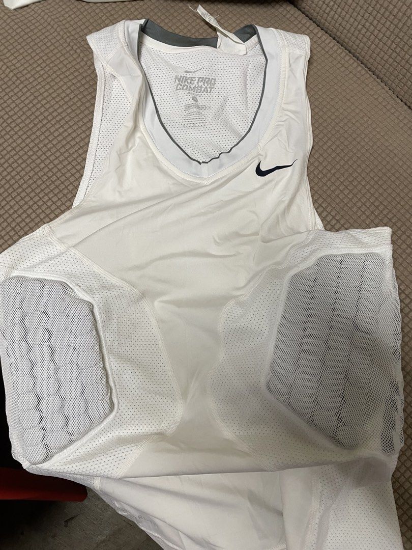 Nike Pro Combat White Padded Compression Top (Category: Activewear) located in Cainta. Submitted by miggysabalboro1571 (Listing ID 1447256678, Image 1). Description: - White Nike Pro Combat sleeveless top - Built-in padding on the sides - Breathable mesh panels on sides and back - Nike swoosh logo on chest - "Nike Pro Combat" printed inside collar - Great for sports like football or rugby.