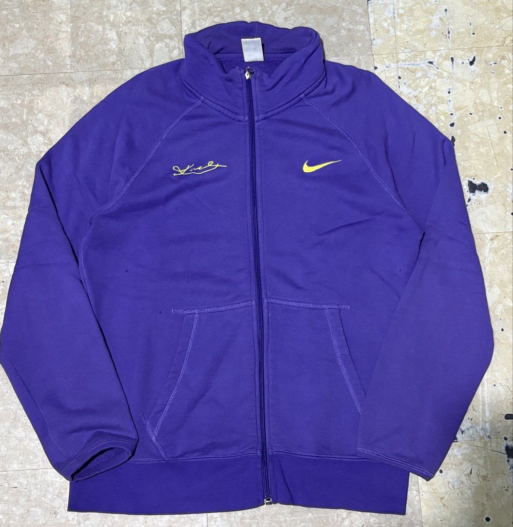 Nike Purple Track Jacket with Signature - Size L (Category: Coats, Jackets and Outerwear) located in Manila. Submitted by jlogup08 (Listing ID 1447282321, Image 1). Description: - Purple Nike track jacket - Yellow Nike swoosh detail -19 by 27 - Signature embroidered on chest - Full zip closure - Convenient pockets - Made in China - Size L - Ideal for casual wear or sports activities.