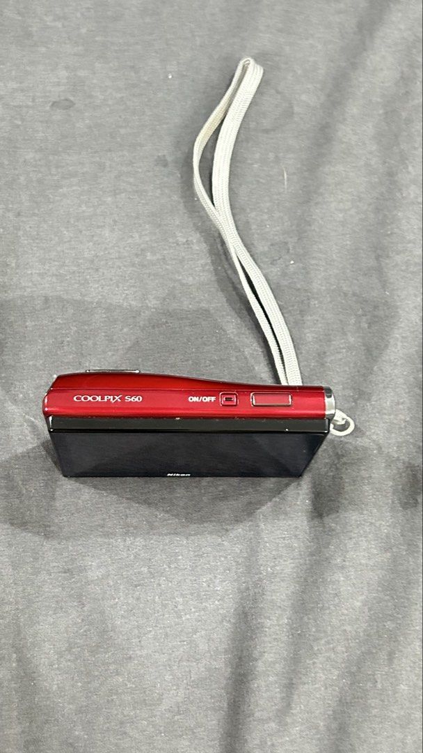 Nikon Coolpix S60 Red Digital Camera with Charger (Category: Cameras) located in San Fernando. Submitted by TheBTBs (Listing ID 1447172429, Image 2). Description: - Red Nikon Coolpix S60 Digital Camera - 3.5 inch Touchscreen - 10x Optical Zoom - Includes Nikon MH-63 Battery Charger and Cables - Great for everyday photos - Ready for its new owner NOTE: The LCD screen has some vignetting/darkening around the corners and edges of the display. This i