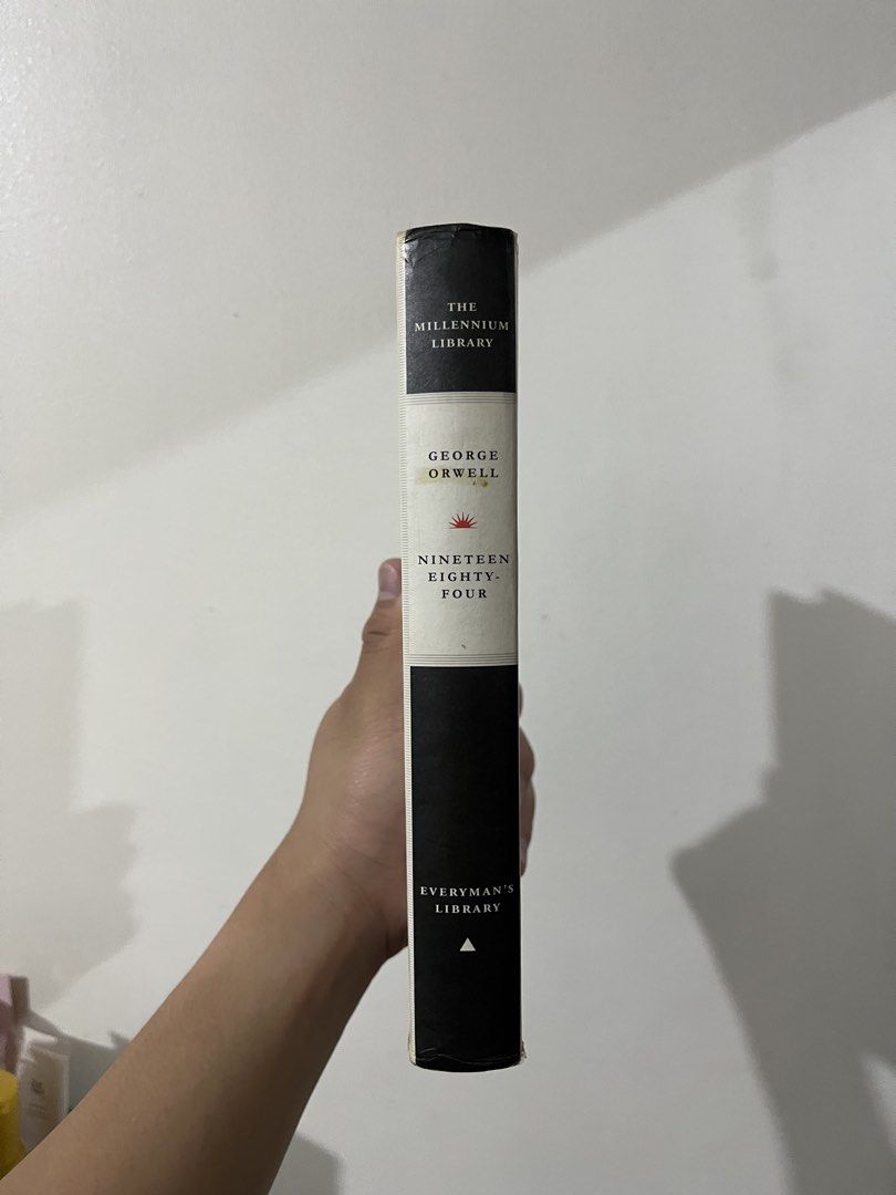 Nineteen Eighty-Four by George Orwell - The Millennium Library (Category: Storybooks) located in Manila. Submitted by darthcauldrone66 (Listing ID 1447167863, Image 2). Description: - Classic dystopian novel by George Orwell. - "1984" title. - Millennium Library edition by Everyman's Library. - Durable library binding. - Features original library return date stamps. - Perfect for collectors and fans of timeless literature. - Location: Malate, Man