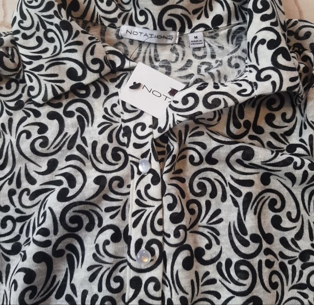 Notations Black and White Printed Sleeveless Blouse Size M (Category: Blouses) located in Cebu City. Submitted by lucypim (Listing ID 1447195784, Image 2). Description: - Brand new with tags - Sleeveless blouse from Notations - Black and white scroll pattern - Button-up front - Elasticated hem - Best fits Small to Medium - Purchased from the US - Selling because it's not my style.