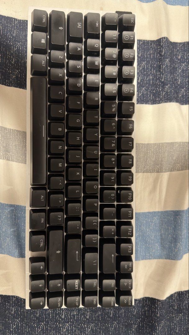 NZXT Mechanical Keyboard (Category: Computer Keyboard) located in Manila. Submitted by ktc004 (Listing ID 1447245566, Image 1). Description: - NZXT Mechanical Keyboard - Compact Tenkeyless Design - Black keycaps with white lettering - Ideal for gaming and everyday typing - Fully functional, ready for a new owner -Used only for 1 month -No box but in very good condition RFS: Change to Hall Effect keyboard.