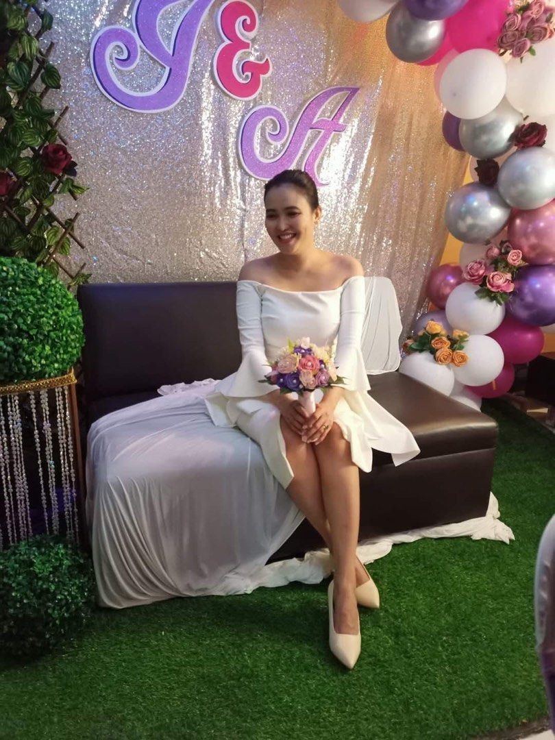 Off-Shoulder Wedding Dress with Bell Sleeves (Category: Dresses) located in Cavite. Submitted by anna1033 (Listing ID 1447239472, Image 3). Description: - Beautiful off-shoulder wedding dress - Elegant bell sleeves - Knee-length cut with a subtle slit - Perfect for civil ceremonies or intimate weddings - Comfortable and chic - Worn once for a wedding - Ready for its next chapter -OG price was Php 20,000 .
