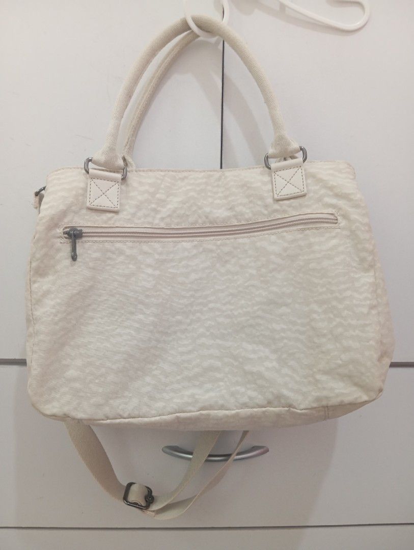 Original Kipling cross body bag (Category: Tote Bags) located in Manila. Submitted by brion123 (Listing ID 1447135780, Image 3). Description: - bought from japan Chic cream Kipling tote bag - Features a subtle leopard print pattern - Comfortable top handles - Includes a detachable shoulder strap for versatility - Multiple interior pockets for excellent organization - Secure zipper closure on top - Ideal for everyday errands or your next getaway.