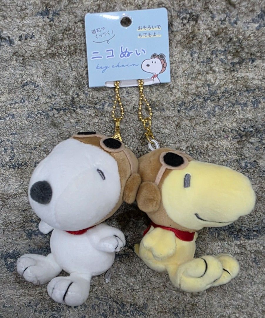Peanuts Snoopy & Woodstock Plush Keychains Set (Category: Plushies & Soft Toys) located in Manila. Submitted by chikawa3 (Listing ID 1447278865, Image 1). Description: Bought in Japan Adorable Snoopy and Woodstock plush keychains with magnet - Features a cute pilot theme with goggles and hats. - Adorned with charming red ribbon bows around their necks. - Ideal for personalizing bags, backpacks, and more. - Officially licensed Peanuts merchandise,
