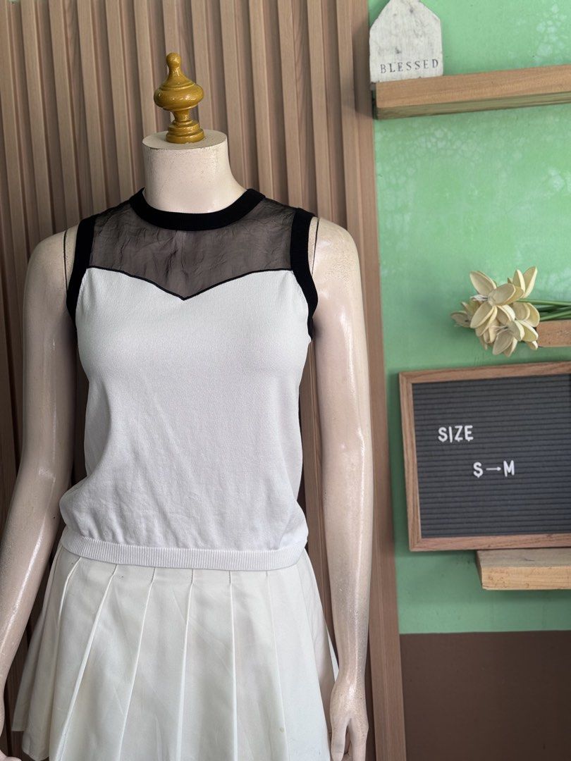 Peoleo black mesh neckline knitted top (Category: Sleeveless) located in Bayombong. Submitted by akmayo (Listing ID 1447128512, Image 1). Description: .
