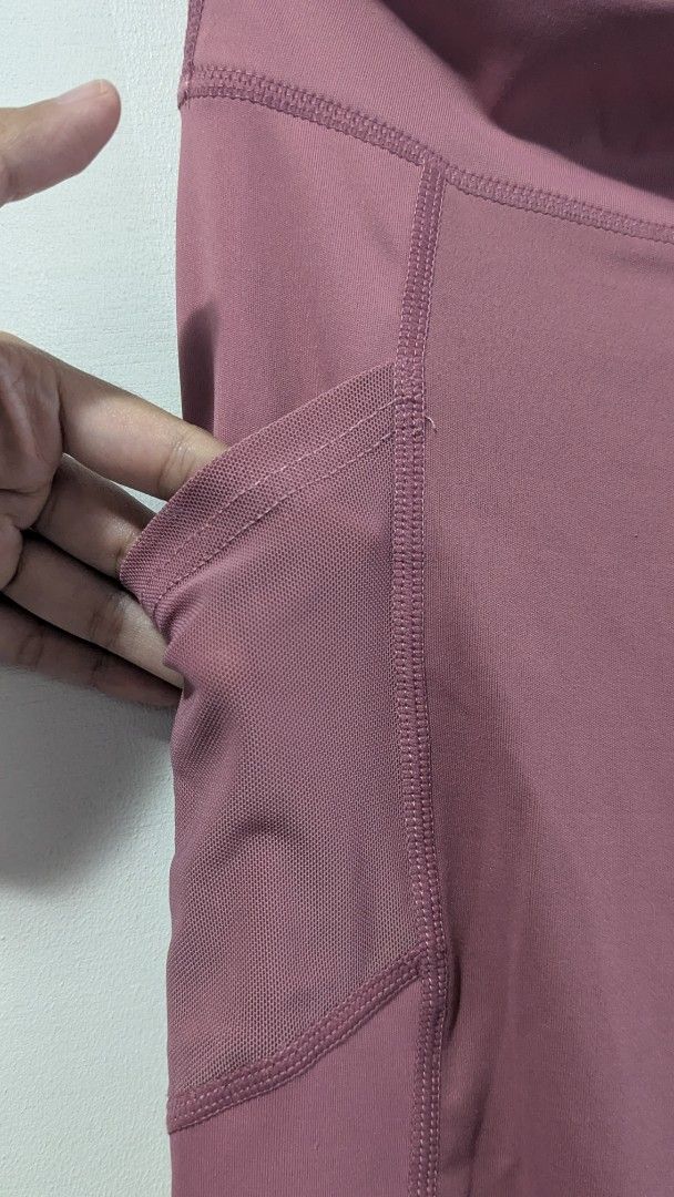 Pink High-Waisted Leggings with Pockets (Category: Activewear) located in Marikina City. Submitted by mlektea (Listing ID 1447179198, Image 3). Description: - Pink leggings used once - Bought online, makapal siya - High-waisted for a comfy fit - Features convenient mesh side pockets - Versatile for workouts or casual outfits - Fits XS to small petite frames.