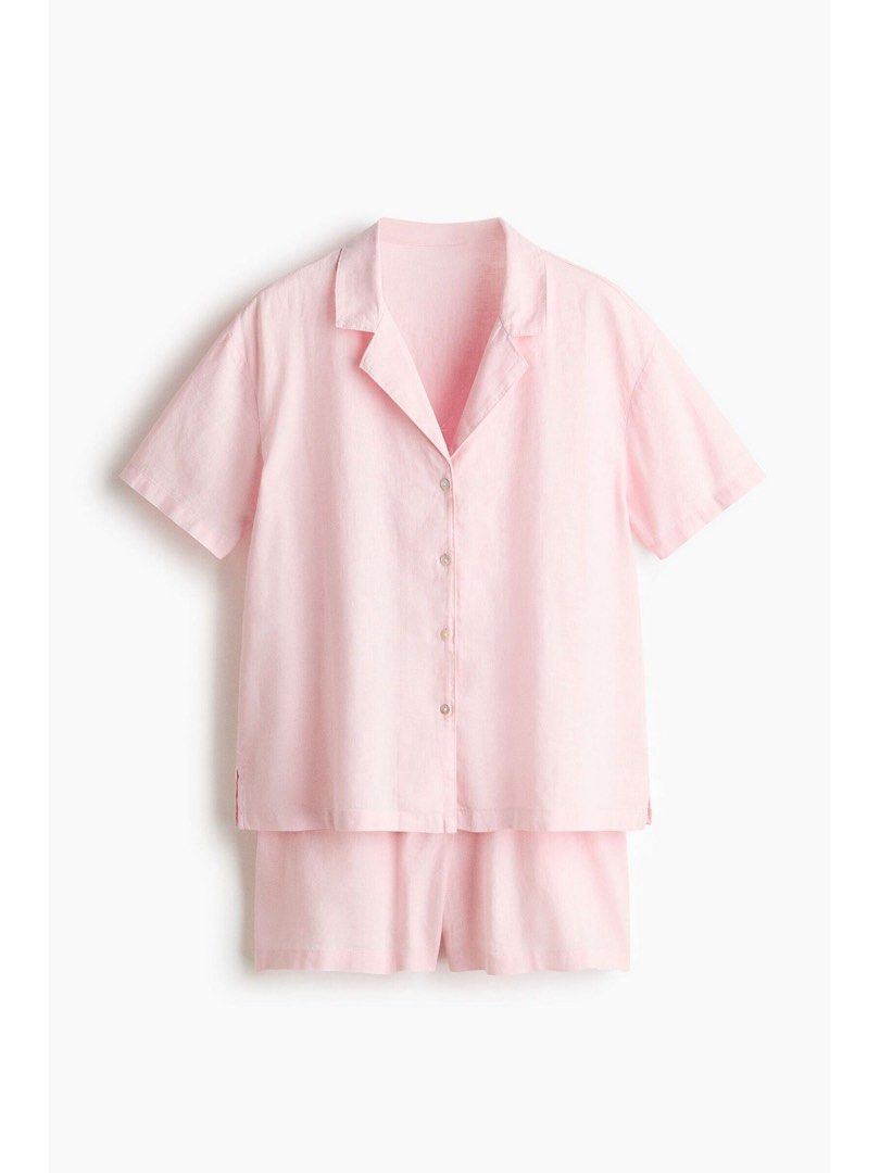 Pink Linen Pajama Set (Category: Undergarments & Loungewear) located in Manila. Submitted by paperthread (Listing ID 1447265200, Image 1). Description: No when worn because they are tied/looped together with the tag - Super comfy pink pajama set - Made from a soft, breathable linen-like material - Short sleeve button-up top - Matching shorts with elastic waistband for a relaxed fit - Ideal for lounging at home.