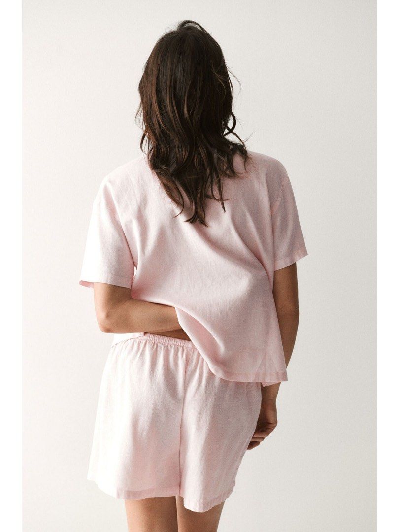 Pink Linen Pajama Set (Category: Undergarments & Loungewear) located in Manila. Submitted by paperthread (Listing ID 1447265200, Image 3). Description: No when worn because they are tied/looped together with the tag - Super comfy pink pajama set - Made from a soft, breathable linen-like material - Short sleeve button-up top - Matching shorts with elastic waistband for a relaxed fit - Ideal for lounging at home.