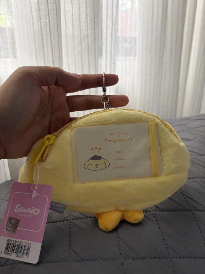 Pompompurin plush wallet (Category: Wallets & Card holders) located in Rizal. Submitted by katmandulovesmakeup (Listing ID 1447123160, Image 3). Description: Retractable key ring Id slot at the bag Bnew authentic sanrio.