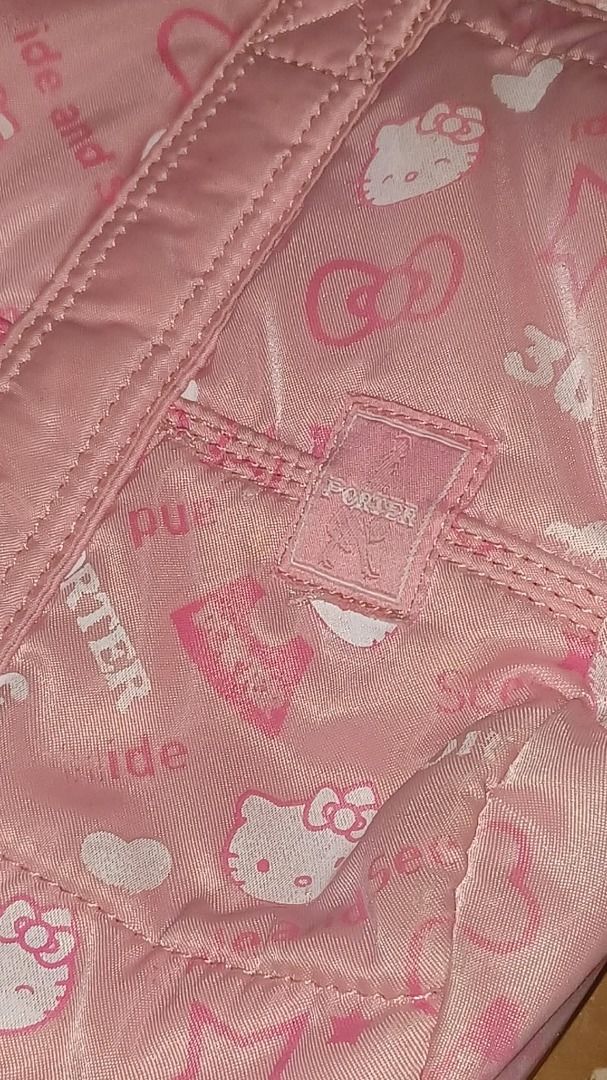 Porter x Hello Kitty Rare Collab Pink Bag (Category: Shoulder Bags) located in Manila. Submitted by missmoneymaker (Listing ID 1447229550, Image 2). Description: - Adorable pink Porter Boston bag - Features a special Kitty 30th anniversary print - Classic Porter logo scattered throughout the design - Equipped with two comfortable top handles - Secure zip closure for your belongings - Ample interior space for essentials - Ideal for travel or every